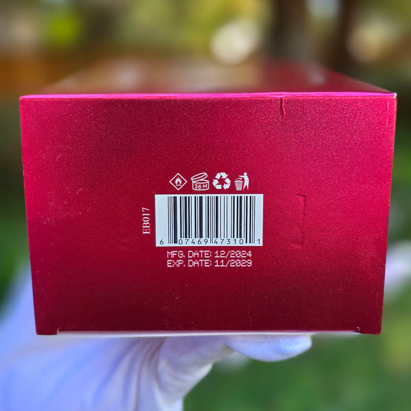 Bottom of Cherry Bomb perfume box displaying barcode, manufacturing date, and expiration date for authenticity.