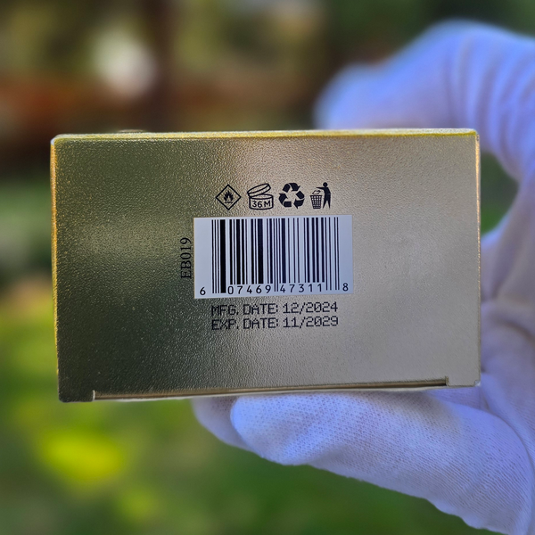 Bottom of DE BILLION perfume box showing barcode, batch number, and manufacturing and expiry dates.