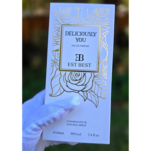 Front packaging design of DELICIOUSLY YOU perfume box with floral golden accents.