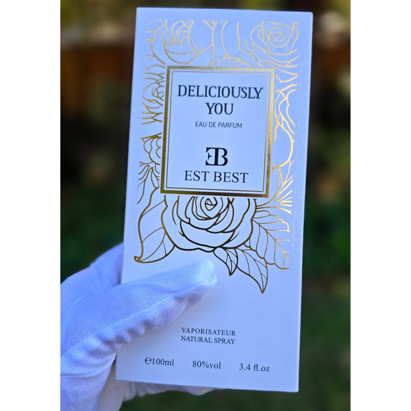 Front packaging design of DELICIOUSLY YOU perfume box with floral golden accents.
