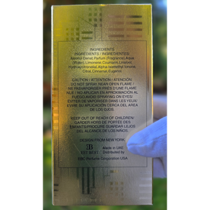 Back of DE BILLION perfume packaging showing ingredients, caution text, and manufacturing details.